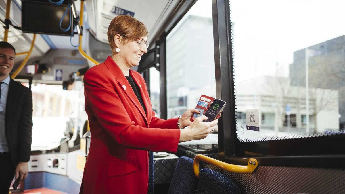 Minister for Health Rachel Stephen-Smith uses the Check In CBR app to sign in on a bus. Picture: Dion Georgopoulos