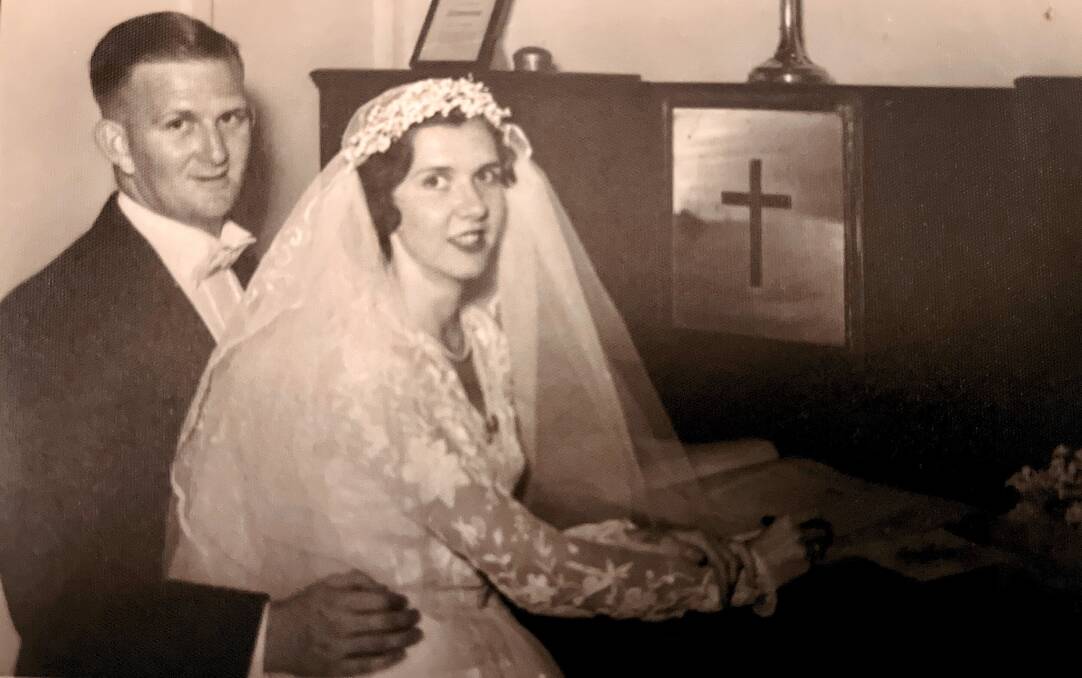 Warren and Mary Nicholl during their wedding in January 1955 at Our Lady Help Of Christians Catholic Church in Epping, NSW. Picture: Supplied