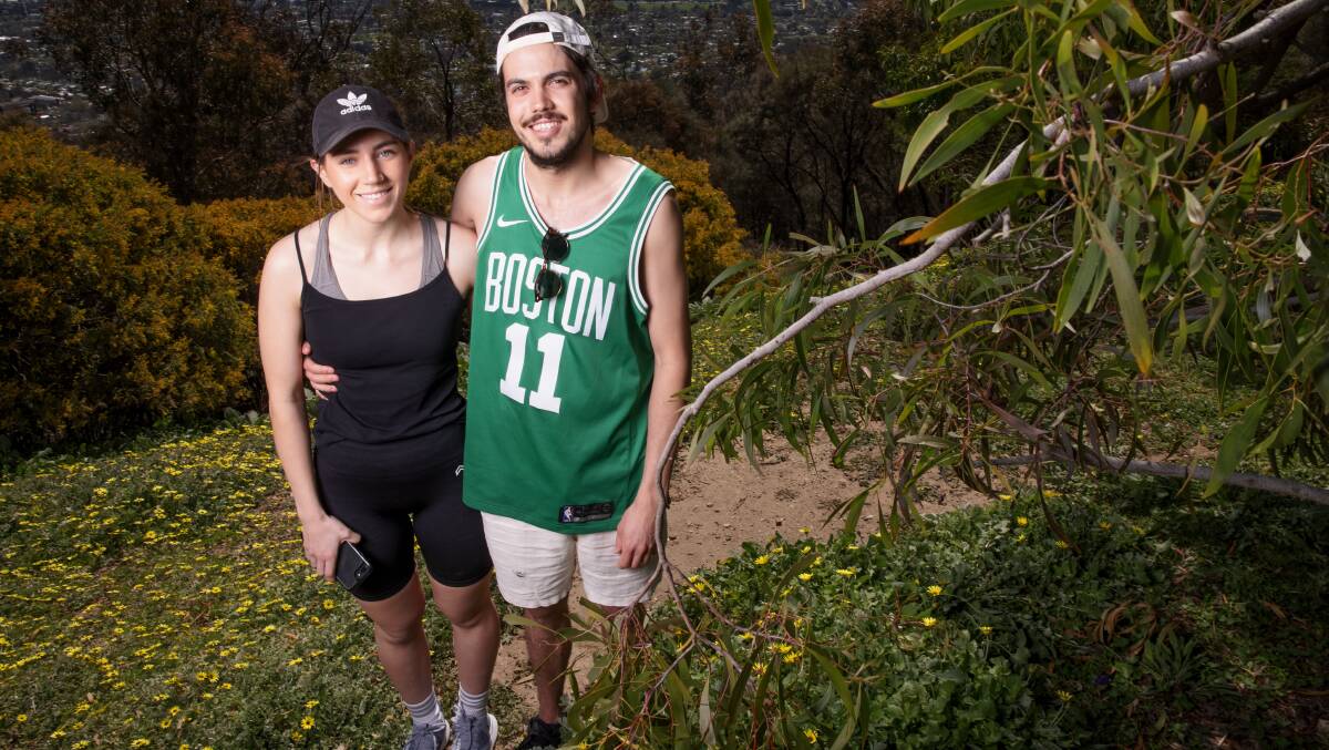 Canberra couple Elizabeth Horobin and Jackson Day walked up Mt Ainslie on Saturday. Picture: Sitthixay Ditthavong