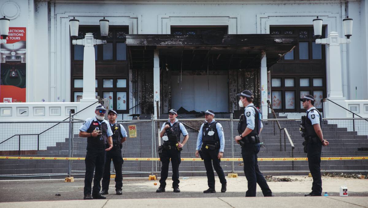 Police are monitoring Old Parliament House precinct after protesters allegedly started a deliberate fire, damaging its doors. Picture: Dion Georgopoulos