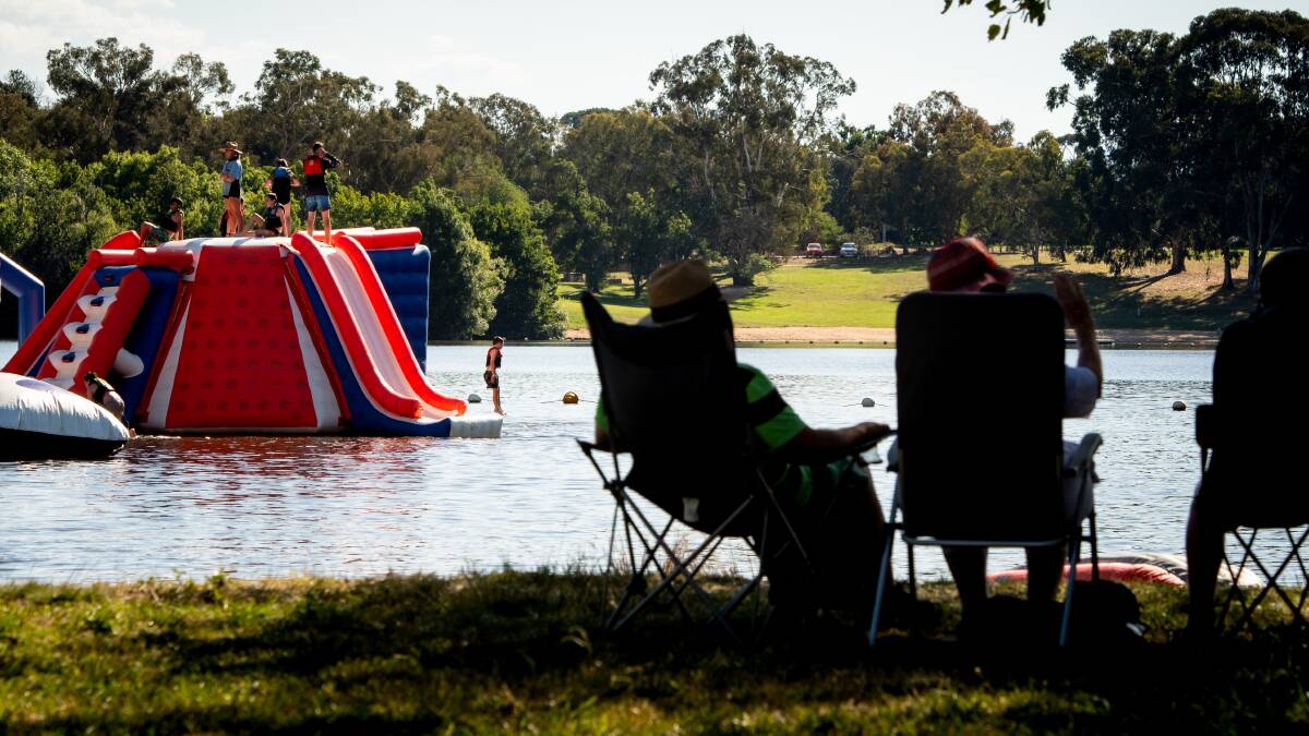 People enjoying the warm weather at Canberra Aqua Park and at Black Mountain Peninsula. Picture by Elesa Kurtz