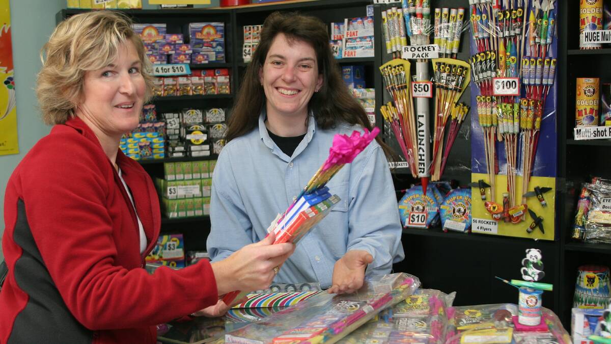 Kristie Beams of Bright Star Fireworks in Burnie is pictured helping customer Paula Rice with her selection of some fireworks in preparation for firecracker night in May.