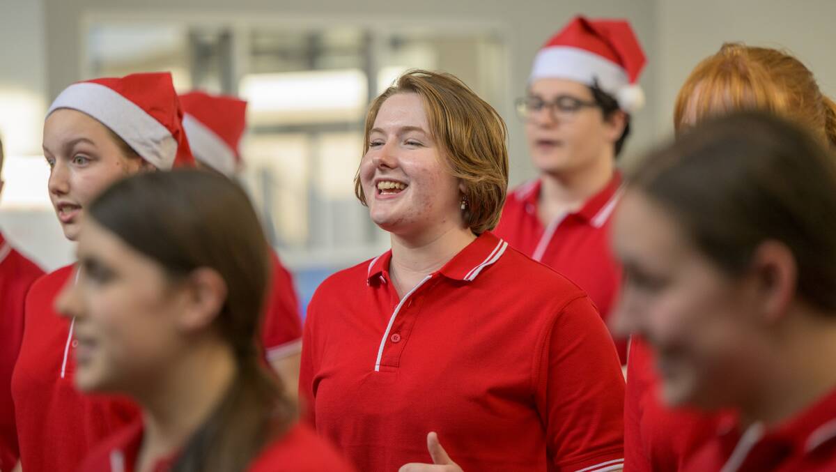 Woden Valley Youth Choir member Evangeline Osborne, 18, prepares for their final rehearsal for the Carols by Candlelight 2023. Picture by Keegan Carroll