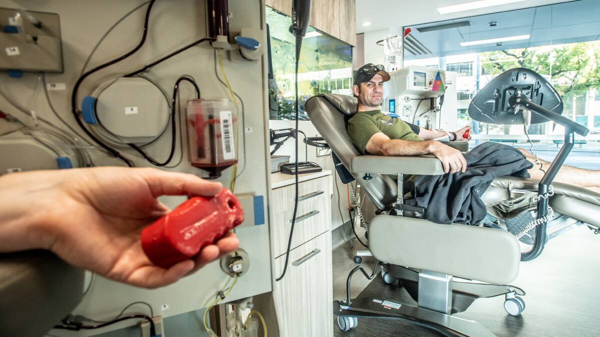 Cameron Lambert of Narrabundah, O+ blood type, gives blood early on Easter Saturday. Picture: Karleen Minney