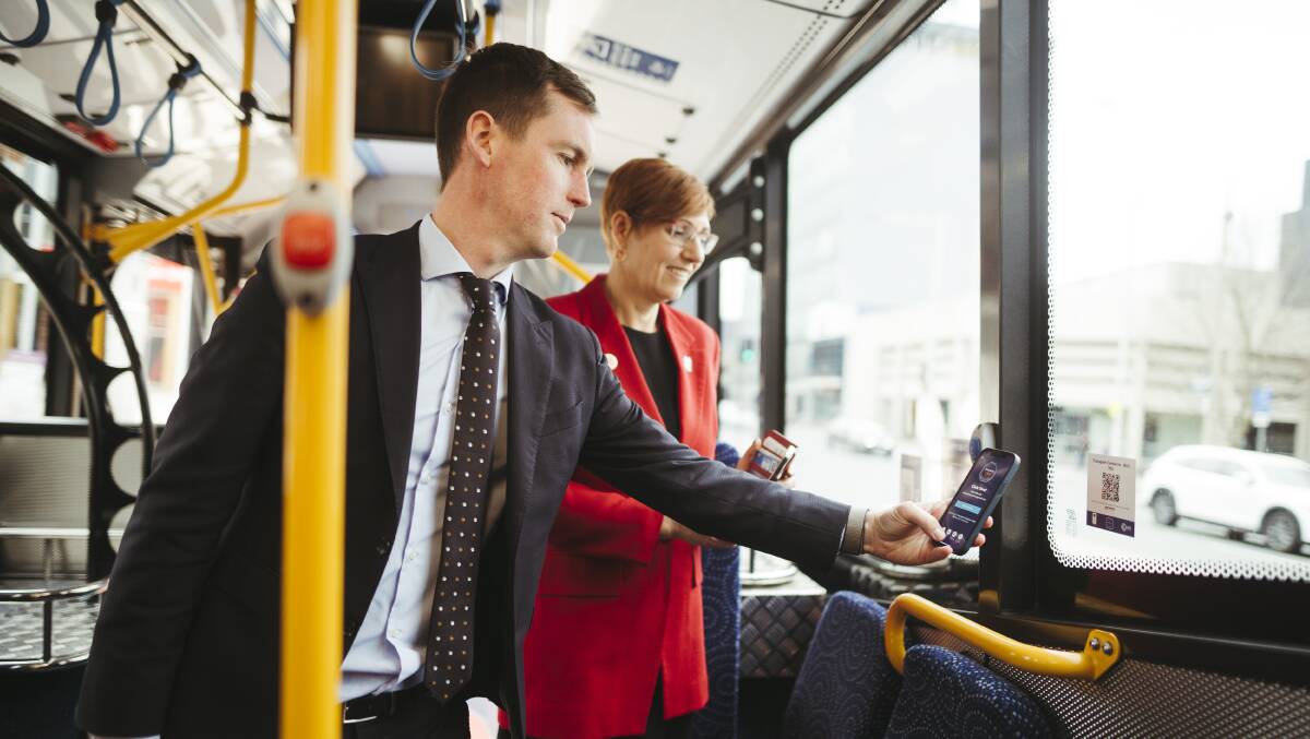 Transport Minister Chris Steel and Health Minister Rachel Stephen-Smith use the Check In CBR app to sign in on a tram. Picture: Dion Georgopoulos 