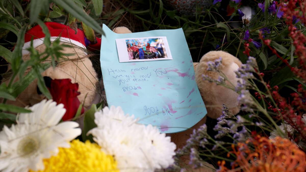 A note and flowers left at Yerrabi Pond District Park, where a vigil will be held on Sunday. Picture by James Croucher