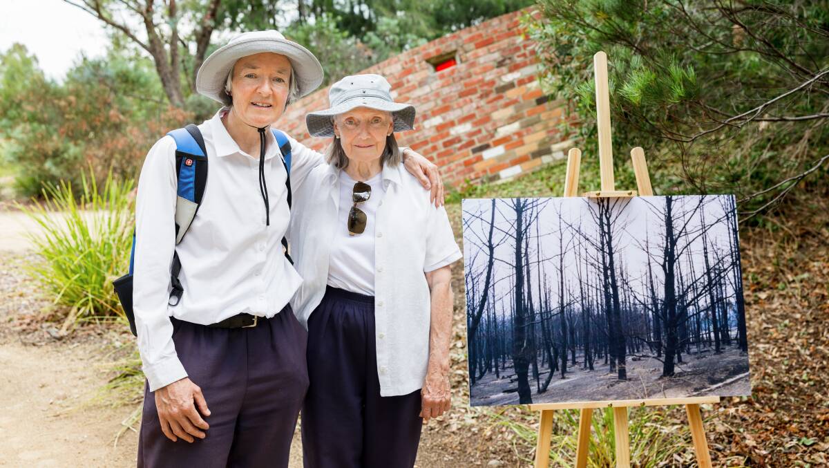 Sarah and Jane Kedge visiting the ACT bushfire memorial on Wednesday. Picture by Sitthixay Ditthavong