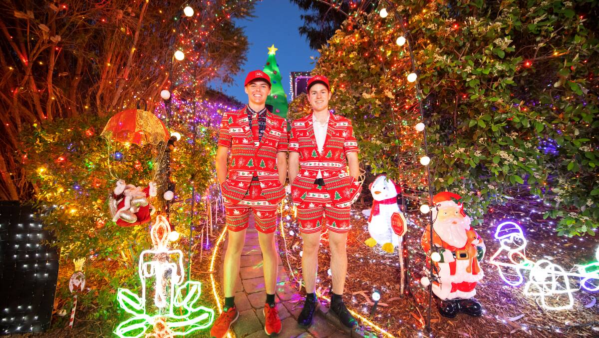 James Crowther and Ben Walker raise funds for MS with their Christmas light displays. Picture: Sitthixay Ditthavong