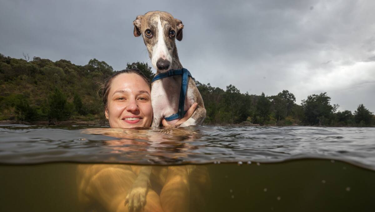Gosia Pilat and whippet Norbert at Uriarra on Thursday. Royal Surf Lifesaving Chief Executive Officer Justin Scarr warned favourite swimming spots may have changed recently. Picture by Sitthixay Ditthavong