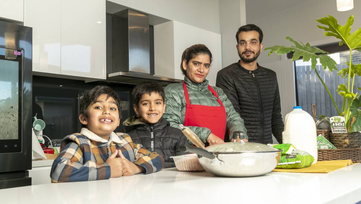 Five-year-old Shivi, seven-year-old Abhiraj, Sandeep and Garry Malhotra have made and delivered thousands of food packages for people struggling in lockdown. Picture: Keegan Carroll