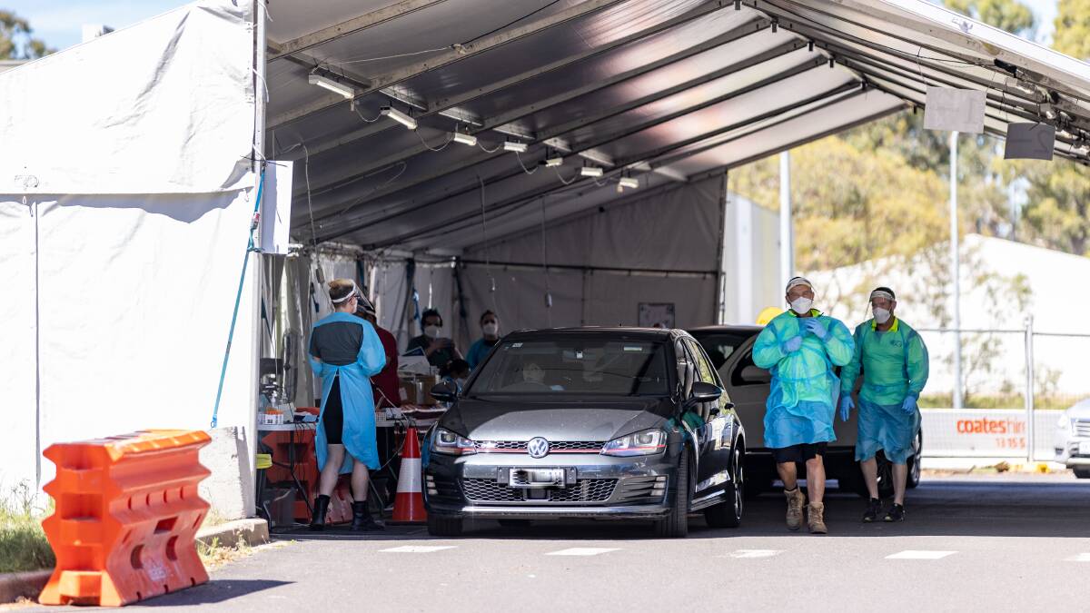 COVID-19 wait times appeared to be shorter than usual on Wednesday. People get testing in Kambah on Wednesday afternoon. Picture: Sitthixay Ditthavong