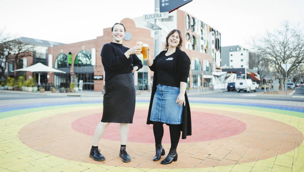 Rahni Orr Deas and Tracy Margrain cheers at Braddon's rainbow roundabout. Picture: Dion Georgopoulos
