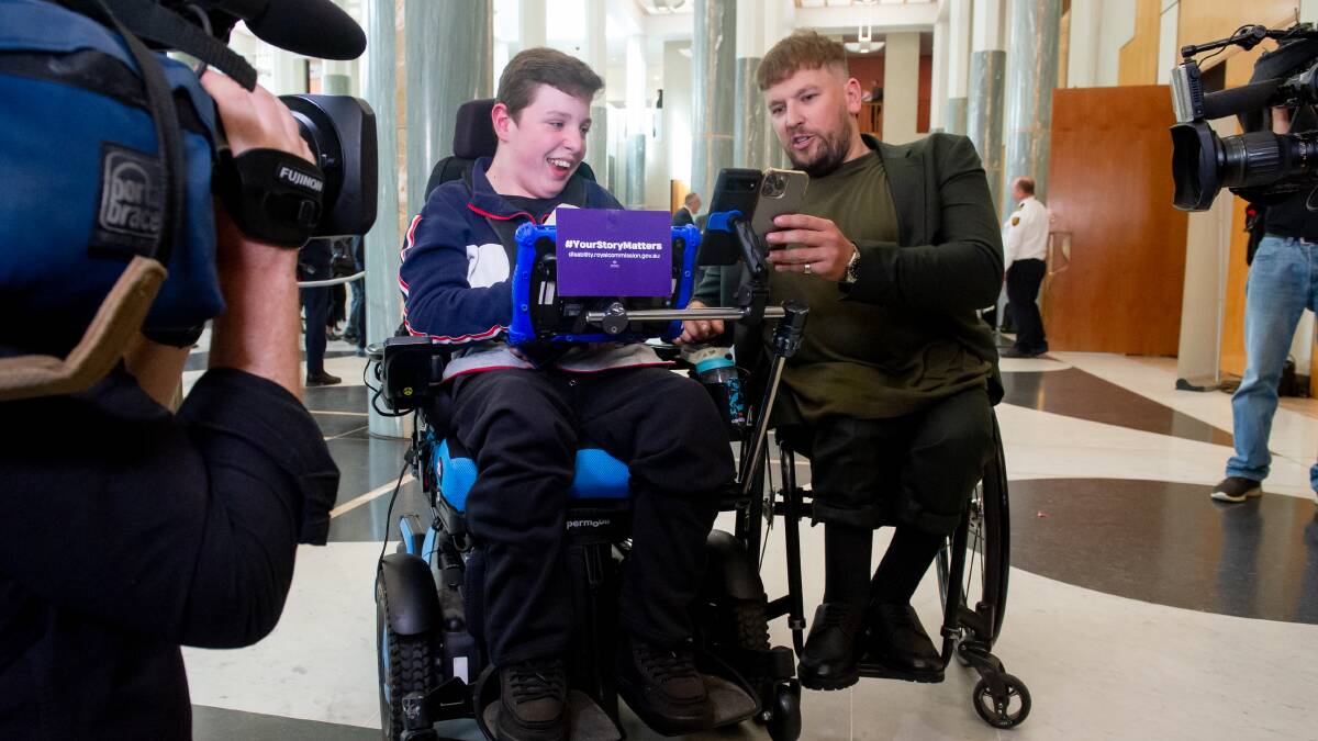 Bas Tech, 13, with Dylan Alcott at Parliament House during Jobs and Skills Summit. Picture by Elesa Kurtz