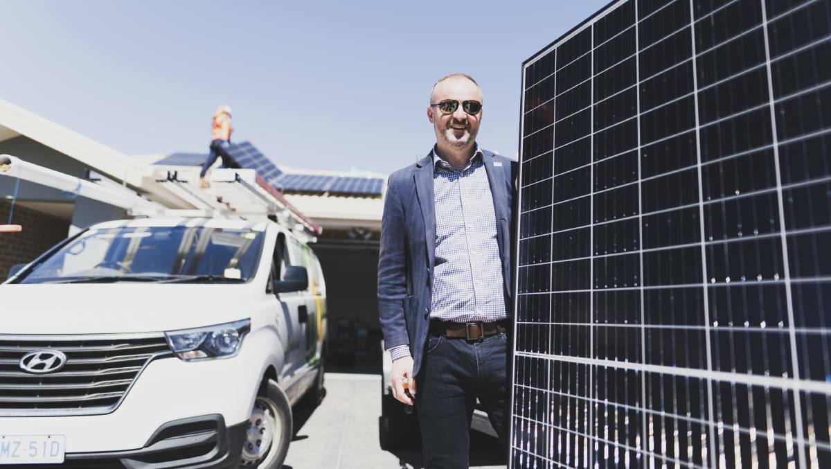 ACT Chief Minister Andrew Barr holding a solar panel. Picture: Dion Georgopoulos
