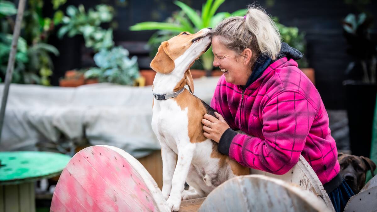 Ms Decker with affectionate beagle Red. Picture: Karleen Minney