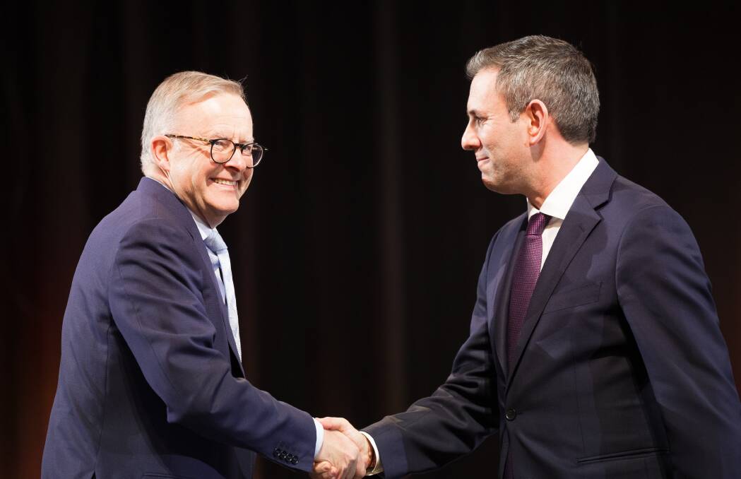 Prime Minister Anthony Albanese is welcomed to the podium by Treasurer Jim Chalmers at the jobs and skills summit on Friday. Picture by Sitthixay Ditthavong