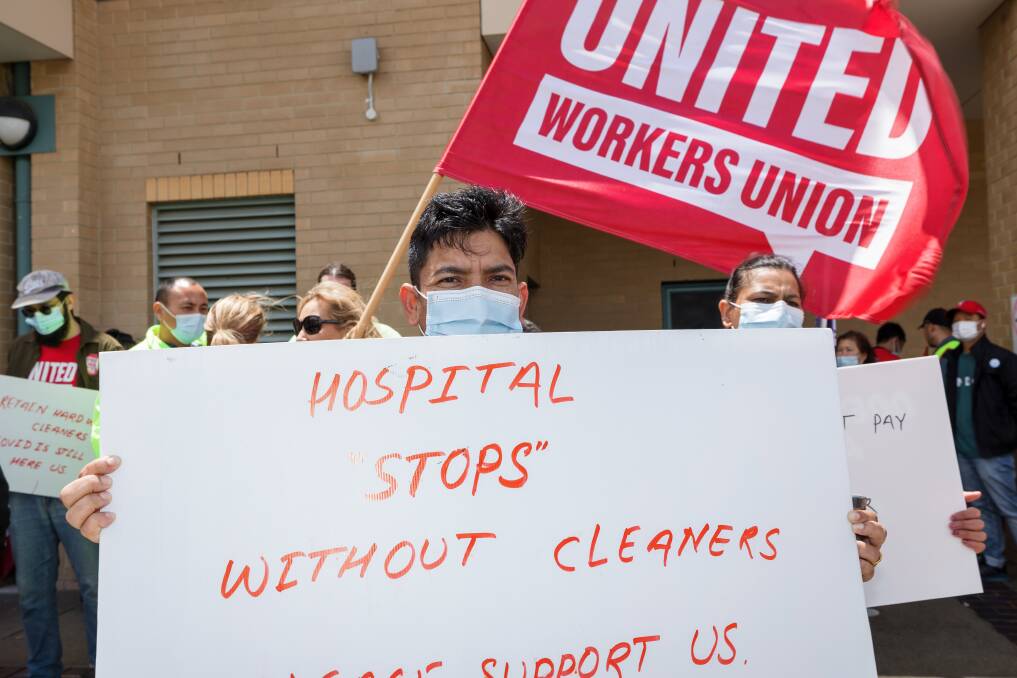 Cleaners rally outside the Canberra Hospital on Monday. Picture by Sitthixay Ditthavong