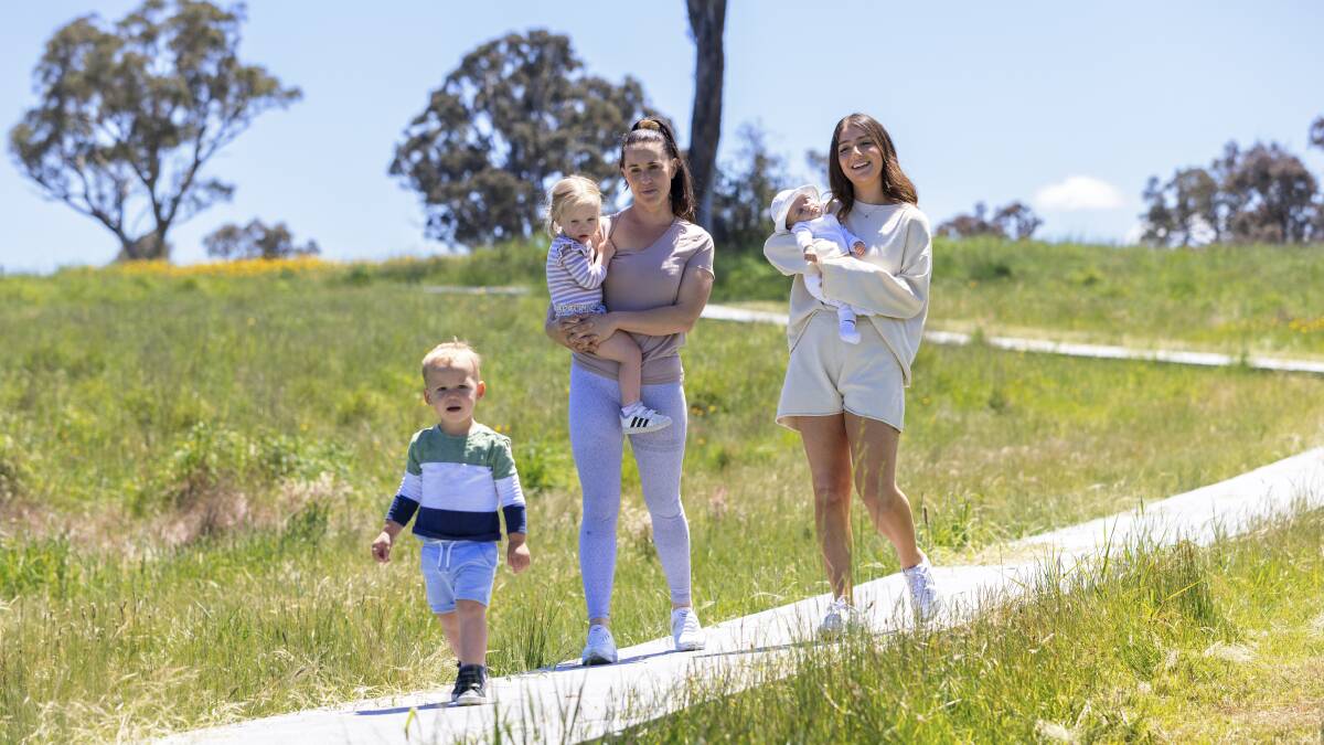 Mum Alex Tyson, left, with twins Sam and Sienna, 2, and Tayla Petersen with baby Mila enjoying Wildbark. Picture by Keegan Carroll