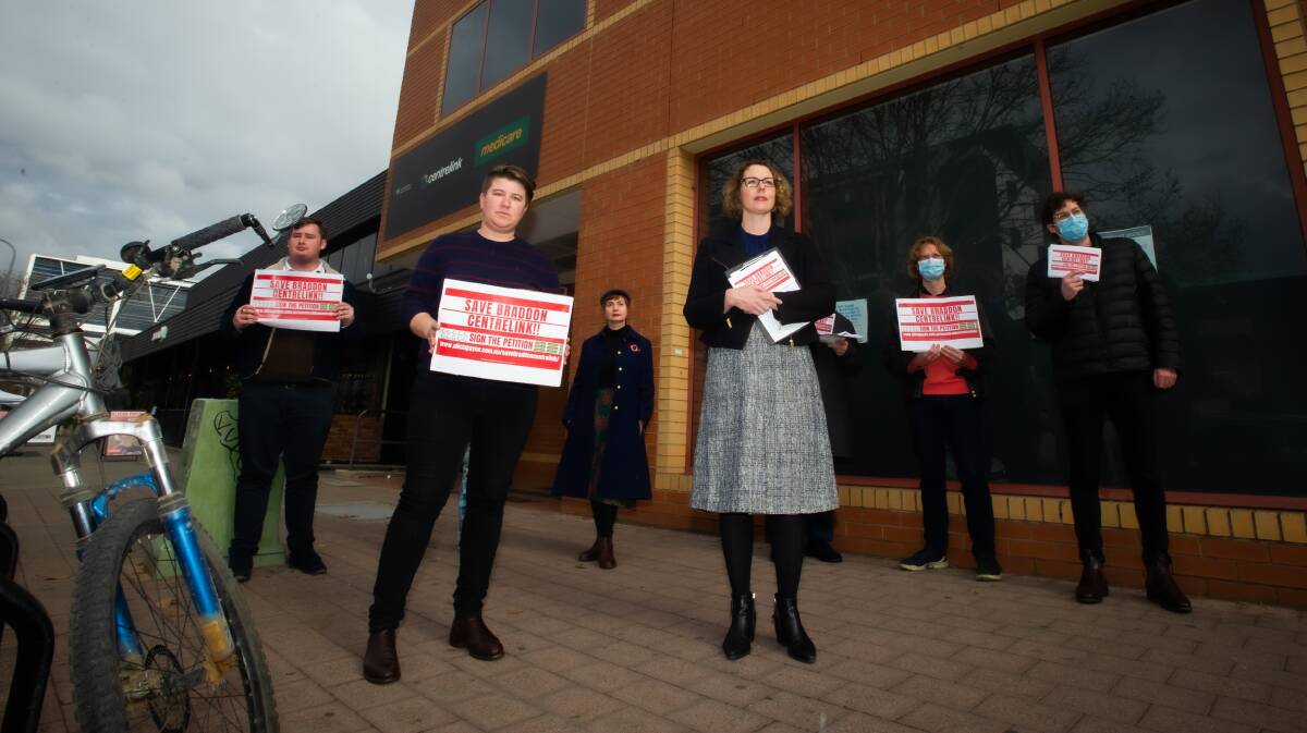 Member for Canberra Alicia Payne, and a small group of people protest the potential closure of the Braddon Centrelink office. Picture: Karleen Minney.