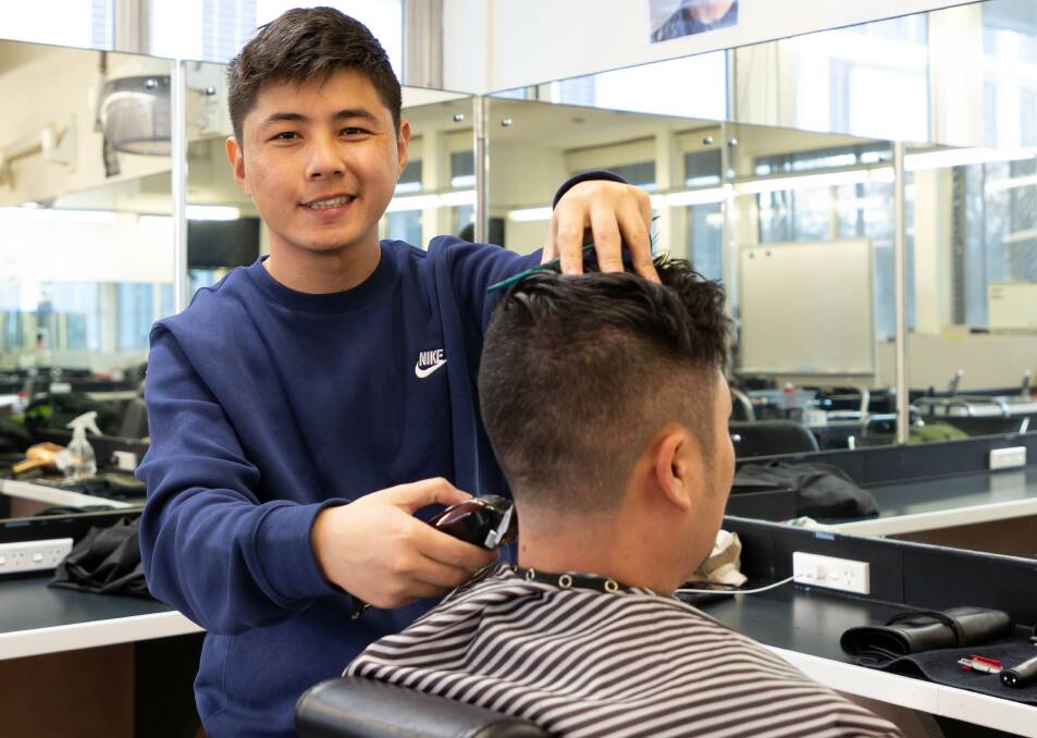 Refugee Tenzin Khenrab won a scholarship to help cover the costs of his Certificate III in Barbering at CIT. Picture: Canberra Refugee Support