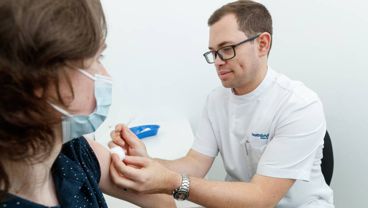 Pharmacist Brady Haskell giving a flu jab. Picture Max Mason-Hubers