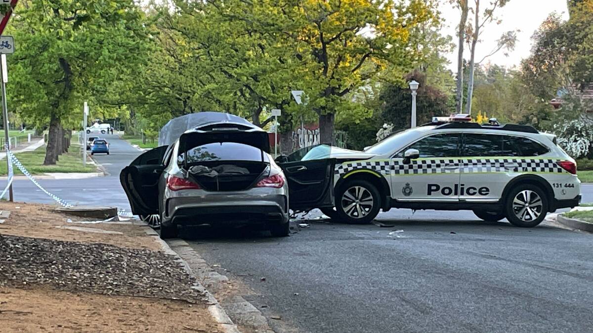 An AFP car and Mercedes have crashed in Turner. Picture: Alex Crowe