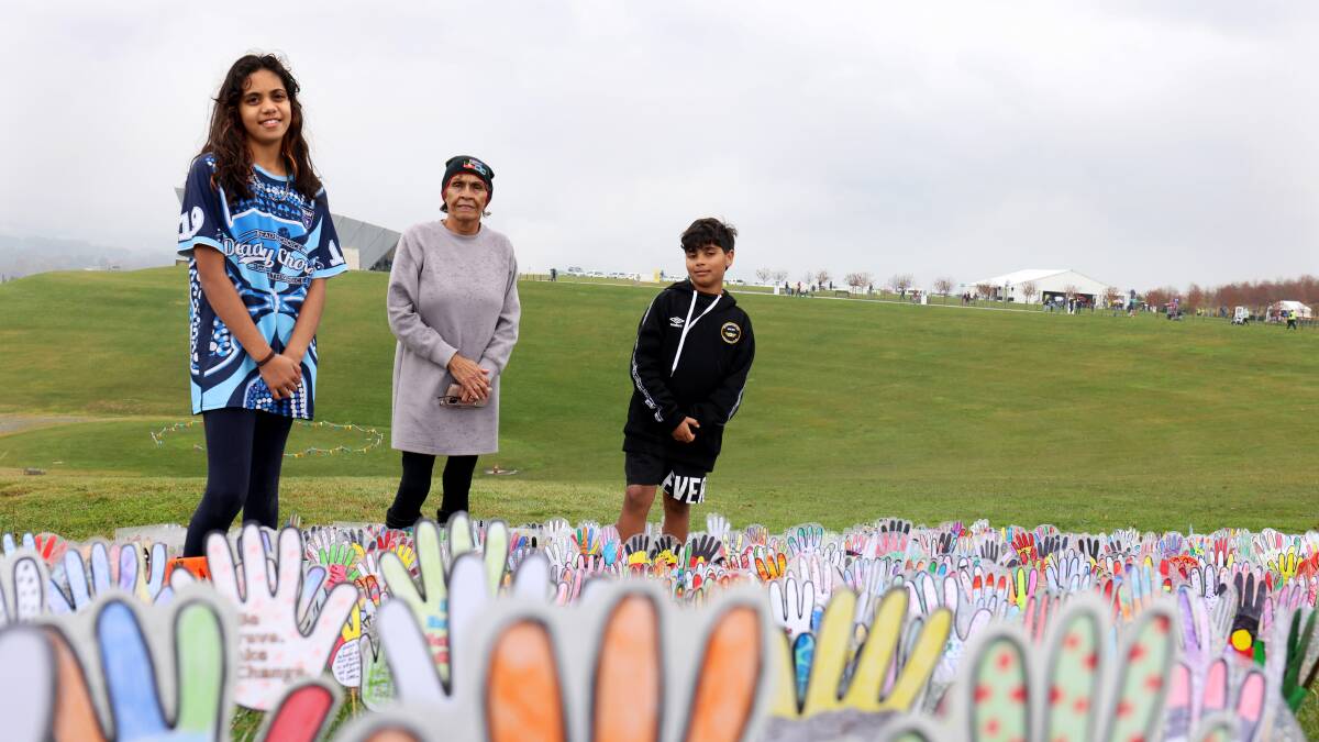 Gracey Coe-Merritt and Kevin Coe-Merritt with Aunty Violet Sheridan at the Reconciliation Day 2022 event held at the National Arboretum in Canberra. Picture: James Croucher