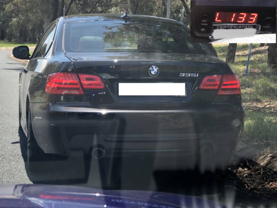 The driver speed past a police car in a black BMW 335i sedan. Picture: Supplied