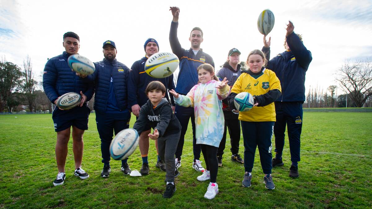 Brumbies players Jacob and Kyah Turto; and Makenzy and Mason Campbell played football with families and children supported by EveryMan's Indigenous program on Tuesday. Picture: Elesa Kurtz
