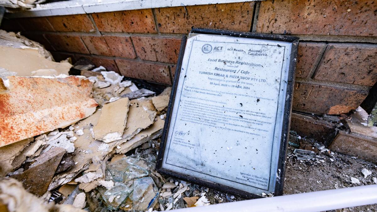 The registration certificate for Turkish Kebab and Pizza survived the blast. Picture: Sitthixay Ditthavong 