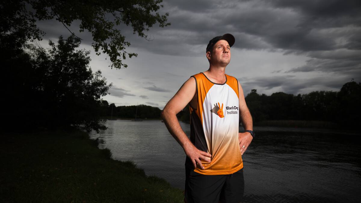 Googong resident Chad Fraser, 41, started running after struggling with his parents' deaths. Picture by Sitthixay Ditthavong