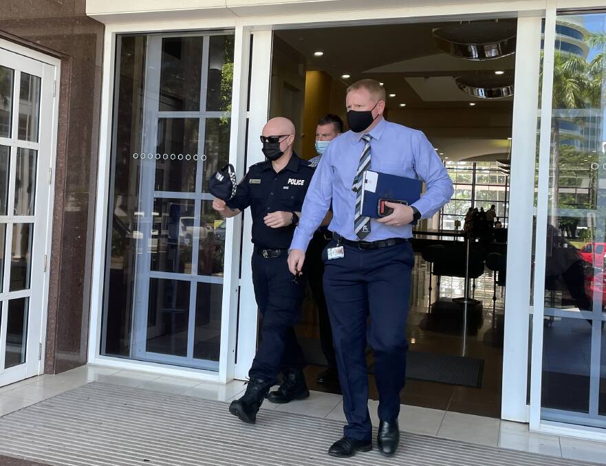Senior Constable Shane McCormack (right) leaves the Darwin Supreme Court after giving evidence. Picture: Sarah Matthews