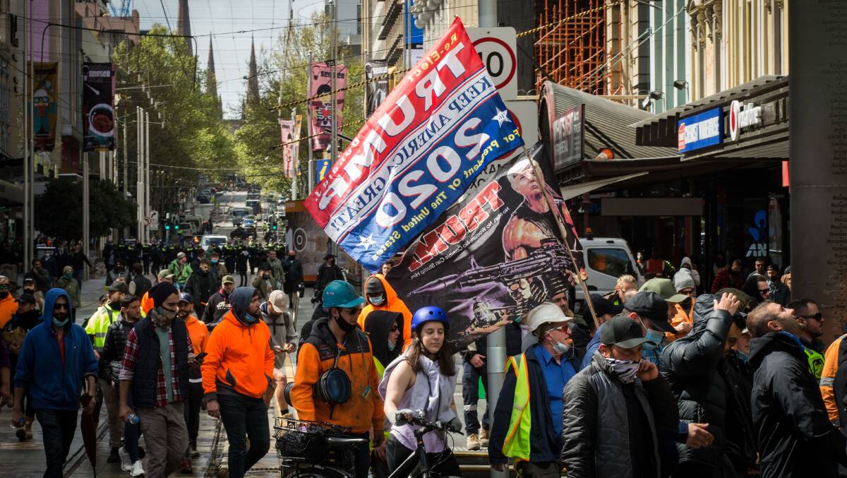 A pro-Trump flag is seen at protests in Melbourne. Picture: Getty Images 