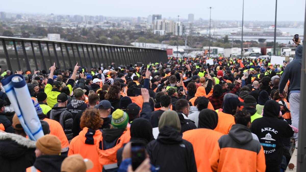 Construction workers swarmed Melbourne's West Gate bridge, bringing traffic to a stand still. Picture: AAP