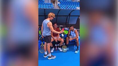 Comedian Elliot Loney (left) films a skit with Australian tennis players Thanasi Kokkinakis (centre) and Nick Kyrgios (right) in the leadup to the Men's Doubles semi-final on Thursday. Photo: Elliot Loney.