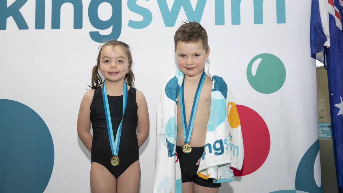 Macgregor Kingswim Students Emily Marks 4 and Max Gunn 4 up on the podium after receiving their medals. Picture: Keegan Carroll