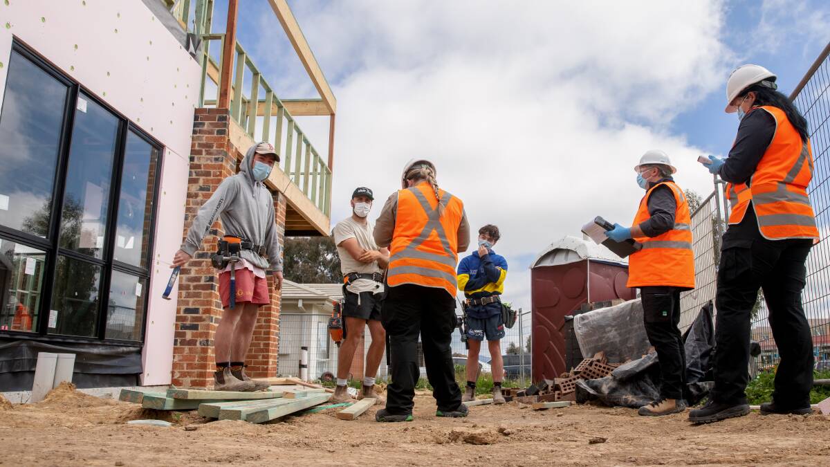 ACT WorkSafe inspectors visit a residential construction site in Throsby on Thursday morning. Picture: Sitthixay Ditthavong.