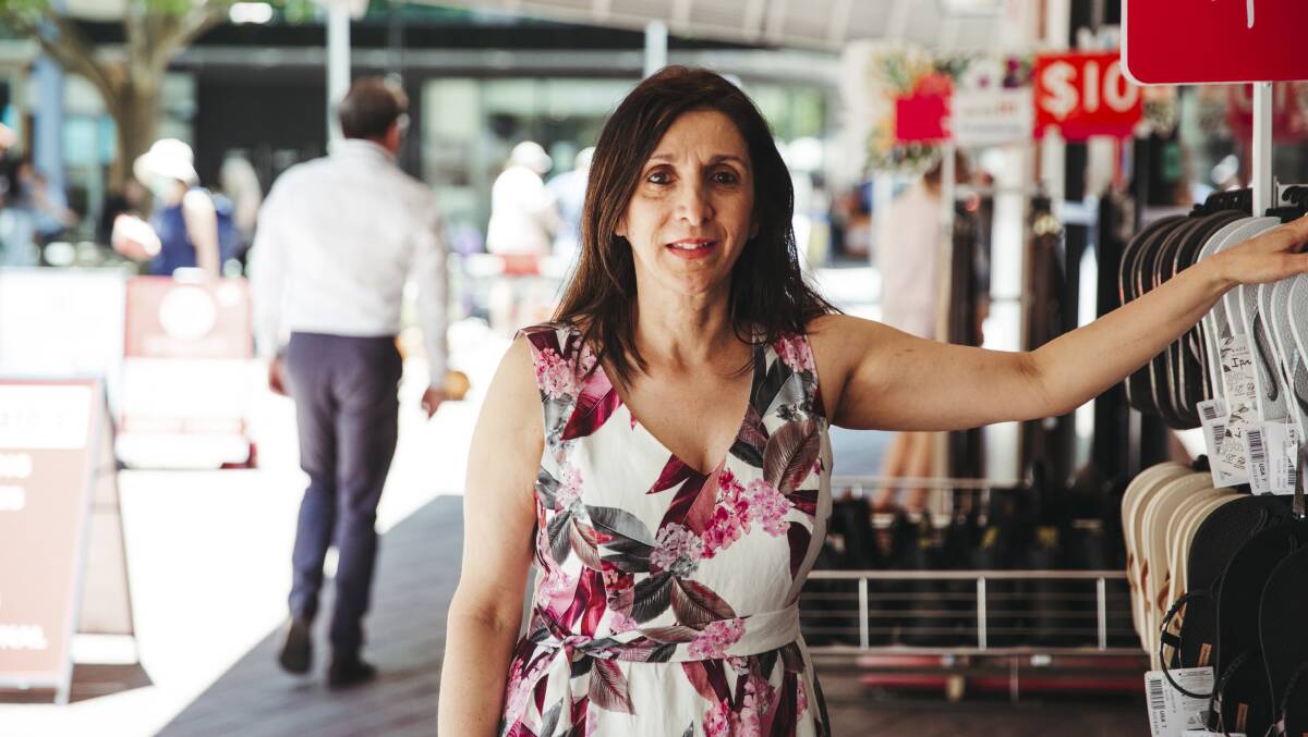 Owner of Redpaths Shoes in Civic Poppy Vassillotis said she's optimistic that Canberrans will launch the economy into the new year with big spends over the holiday period. Picture: Dion Georgopoulos