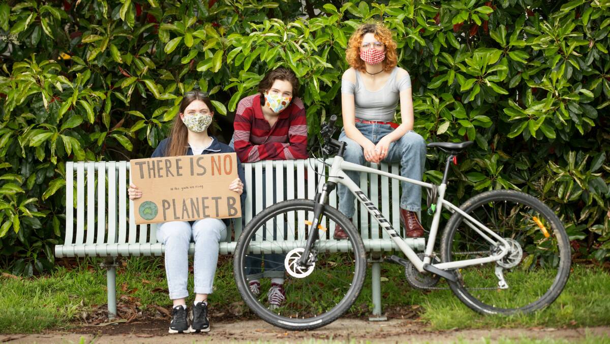 Student climate activists Kate Loynd, Rosie Brady, and Jimmy Hollo. Picture: Sitthixay Ditthavong.