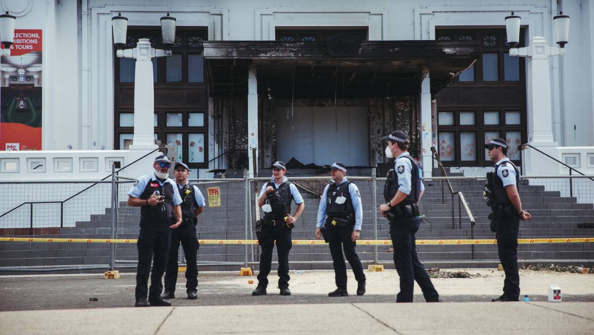 Police guard the scene of the fire at Old Parliament House on Friday. Picture: Dion Georgopoulos