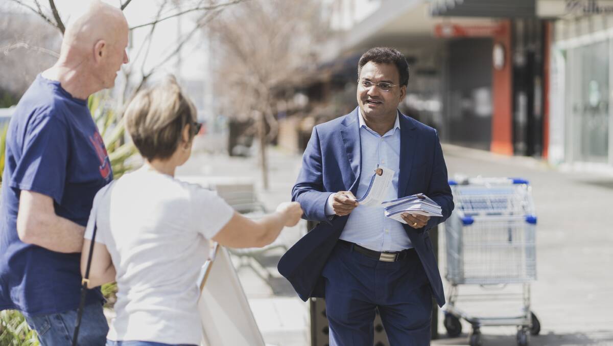 Jacob Vadakkedathu handing out pamphlets for the Liberals during the 2020 ACT election. Picture by Dion Georgopoulos