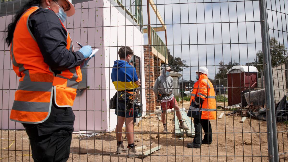 Work Health and Safety Commissioner Jacqueline Agius, right, visits a residential construction site in Throsby on Thursday morning. Picture: Sitthixay Ditthavong.