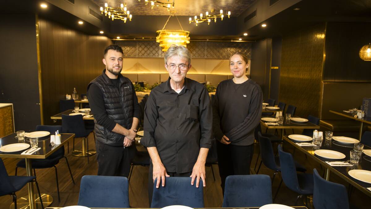 Kadir Seven, owner of Little Istanbul restaurant, with staff members Yunus Seymen and Imogen Parker. Picture: Keegan Carroll