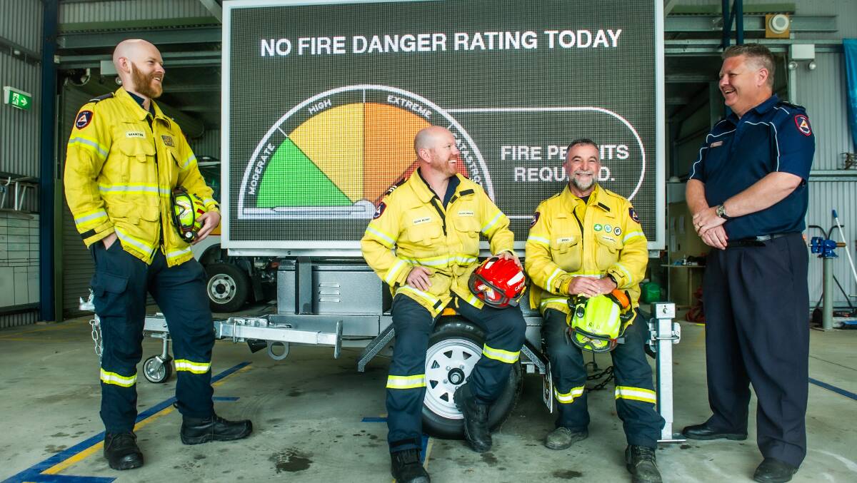 Volunteer RFS firefighters, left to right, Martin Greenwood, Sean Blunt and Rod Channon and ACT RFS chief officer Rohan Scott, far right. Picture by Karleen Minney