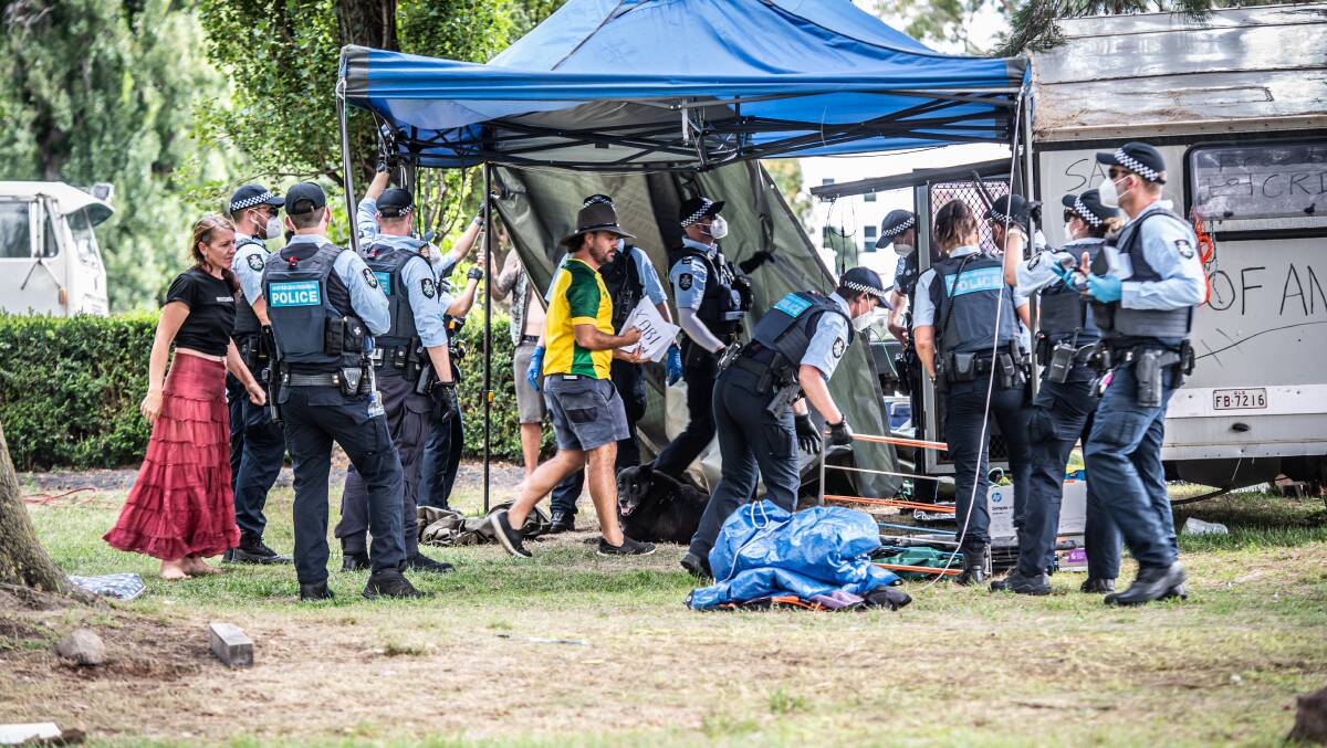Police worked to take structures down after protesters were told they needed to pack up by 4pm on Friday. Picture: Karleen Minney