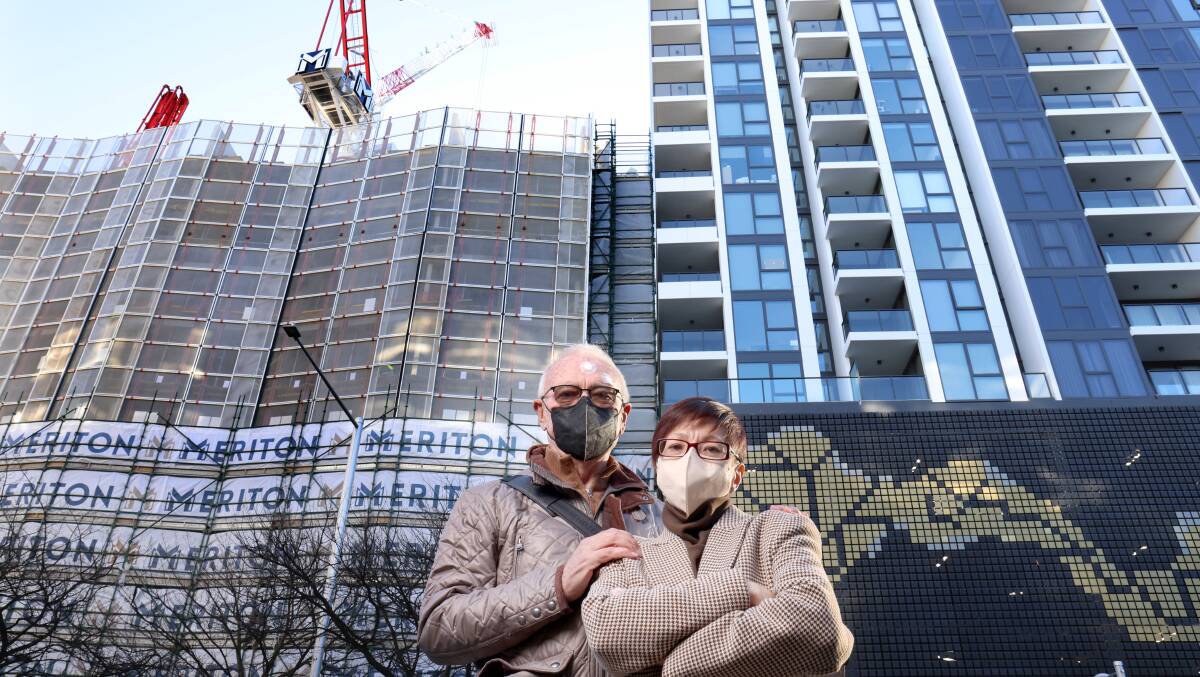 Ian Mallet and Rebecca, residents of Park Avenue say the Meriton development nextdoor is infringing on their privacy. Picture: James Croucher