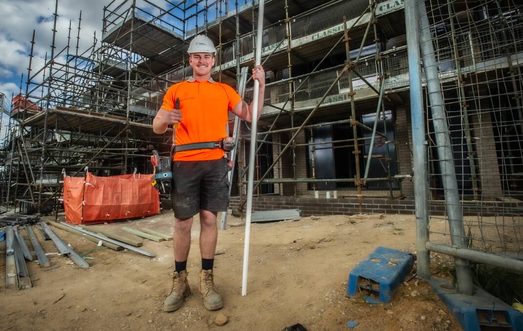 Second-year electrical apprentice Tex Cassidy on the job. His employer, Enercorp, is among the many ACT businesses struggling to fill apprenticeships. Picture: Karleen Minney