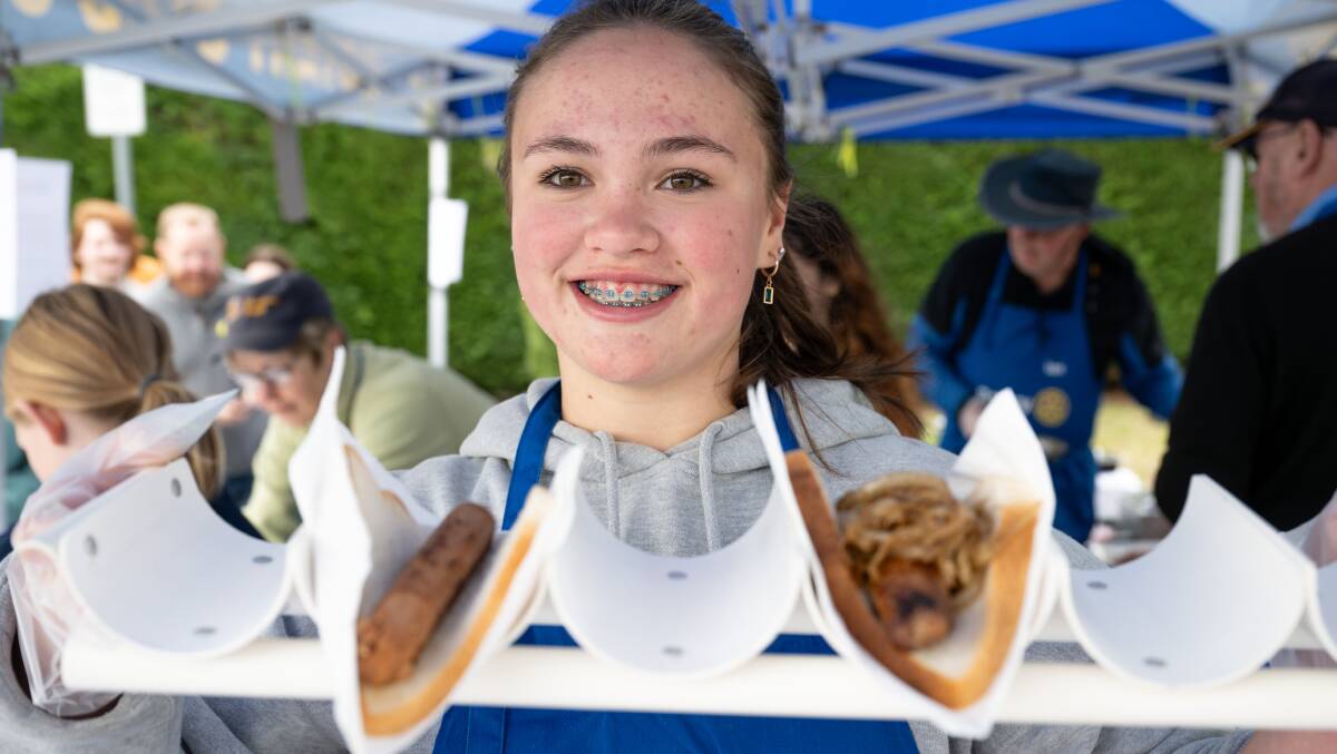 Aylish Hoban, 15, of Farrer volunteered with Rotary Club serving democracy sausages. Picture by Elesa Kurtz