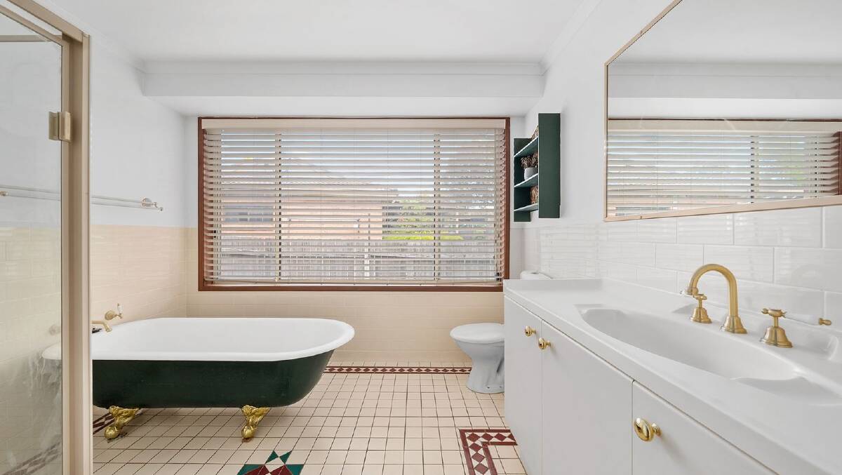 A claw-foot bath sits in the corner of the main bathroom. Picture Murphstone Media