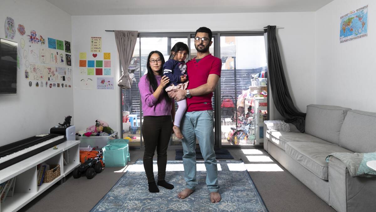 Najam Us Saqib, pictured with his wife Risa Matsuda and daughter Maeisha Najam, 3, hopes the ACT will introduce apartment defect insurance. Picture by Keegan Carroll